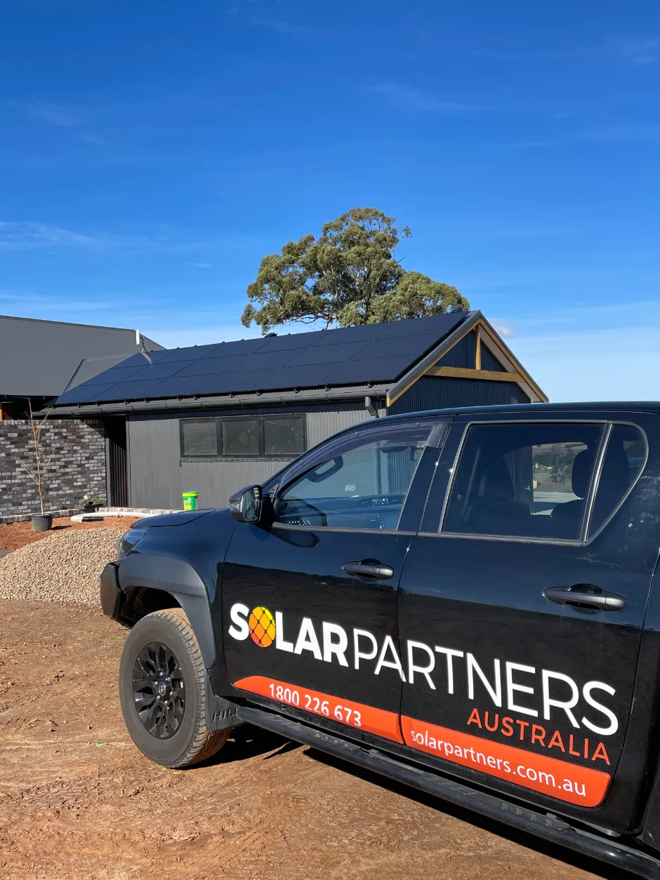 Solar Partners ute outside a home with a newly installed solar system Solar Partners ute outside a home with a newly installed solar system